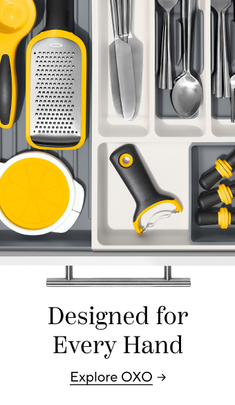 Designed for Every Hand.  Explore OXO. Drawer with black and yellow kitchen tools.