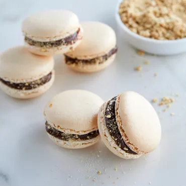 S'more macarons with chocolate filling and graham cracker crumbs
